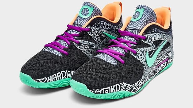 View of black and green Nike KD shoes.